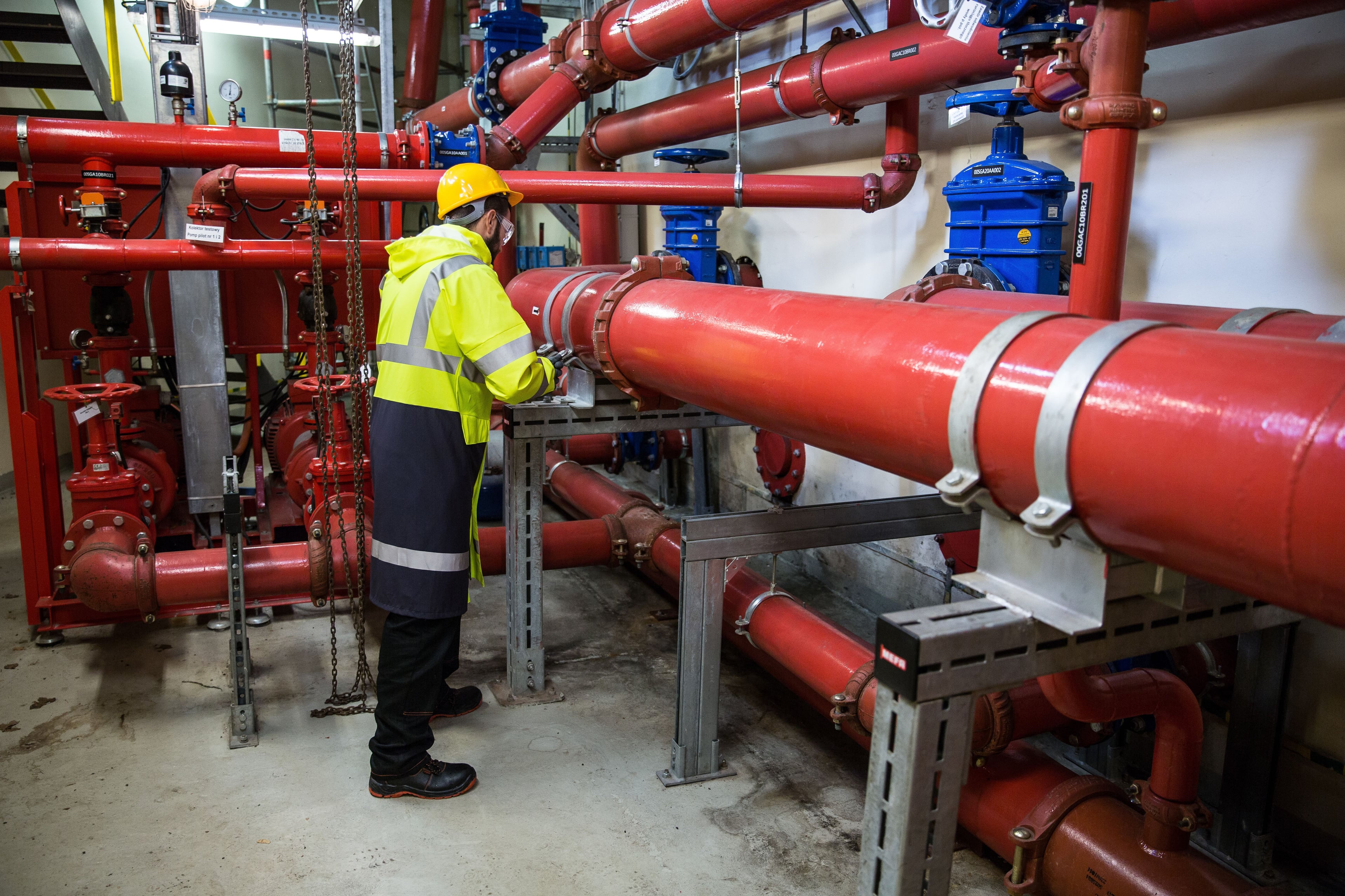 Friendly licensed plumber taking care of home plumbing